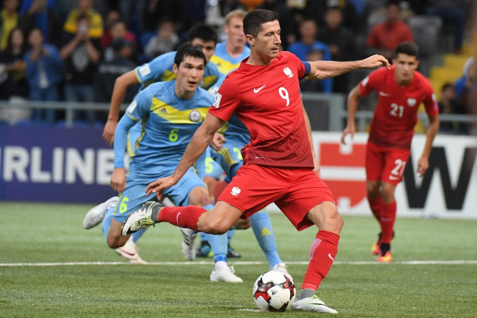  Robert Lewandowski fired Poland into a two-goal lead in Kazakhstan