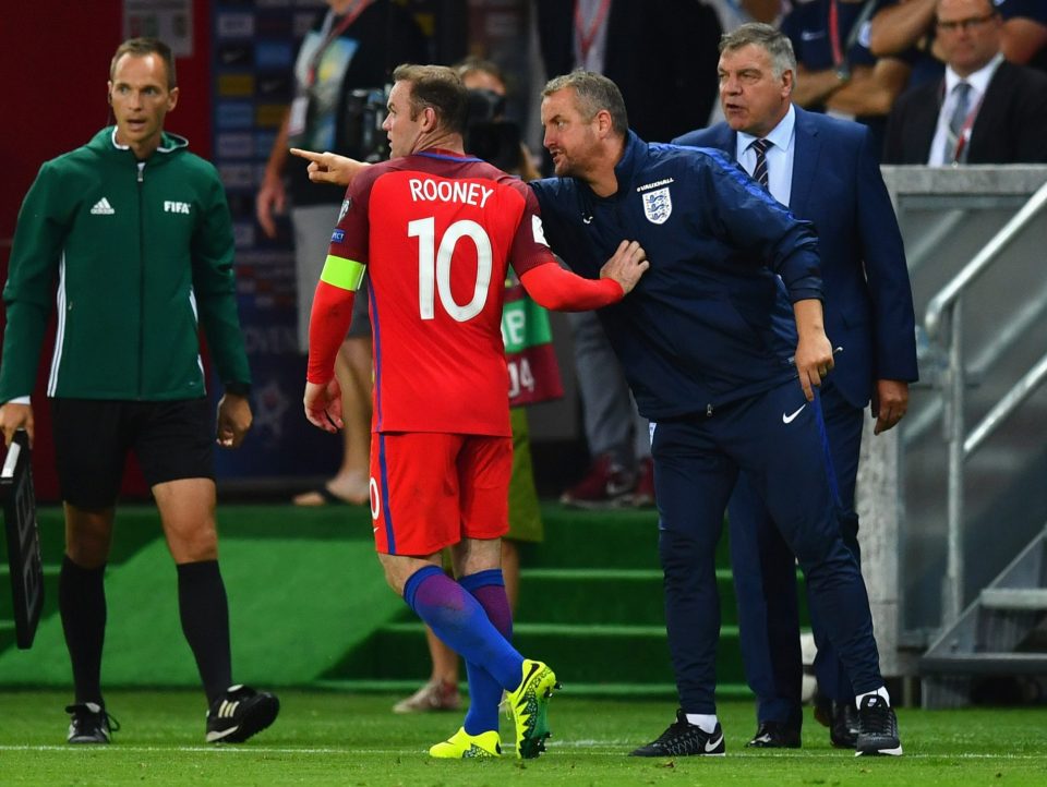 TRNAVA, SLOVAKIA - SEPTEMBER 04: Martyn Margetson goalkeeping coach of England and Sam Allardyce manager of England give instructions to Wayne Rooney of England during the 2018 FIFA World Cup Group F qualifying match between Slovakia and England at City Arena on September 4, 2016 in Trnava, Slovakia. (Photo by Dan Mullan/Getty Images)