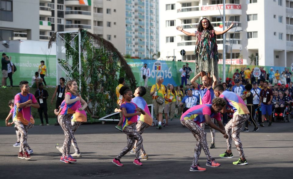 Dancers perform during a welcome ceremony for Great Britain in the athletes' village