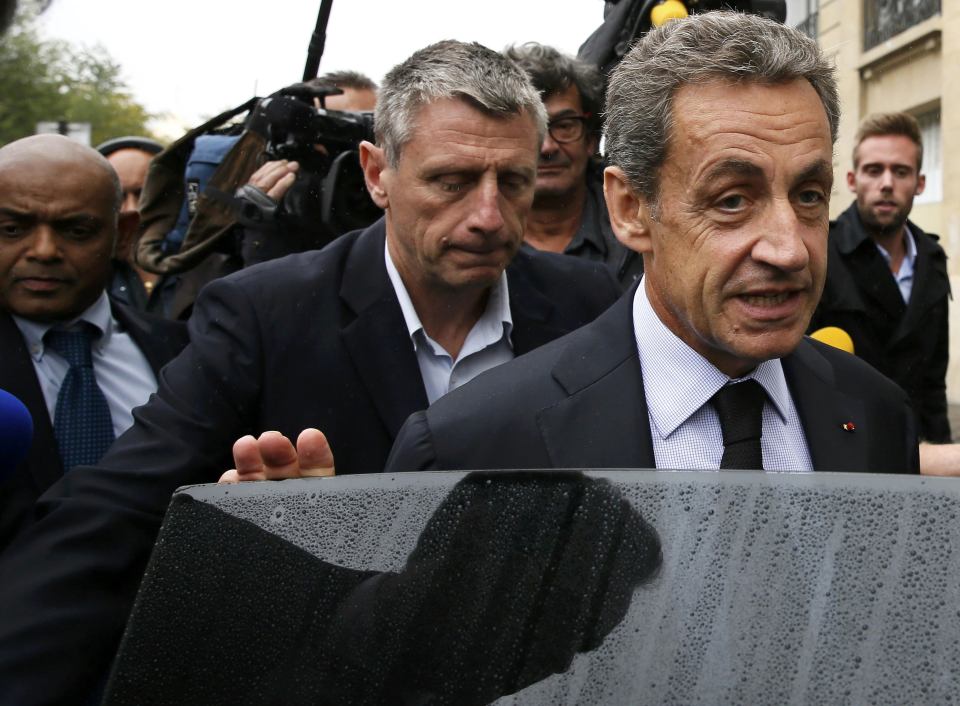  Nicolas Sarkozy is confronted by media as he leaves his campaign headquarters today