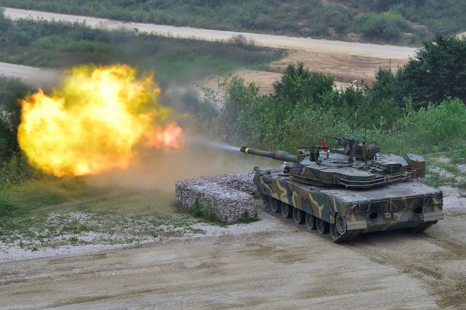  A South Korean K1A2 tank fires during a live demo at the Defense Expo Korea 2016