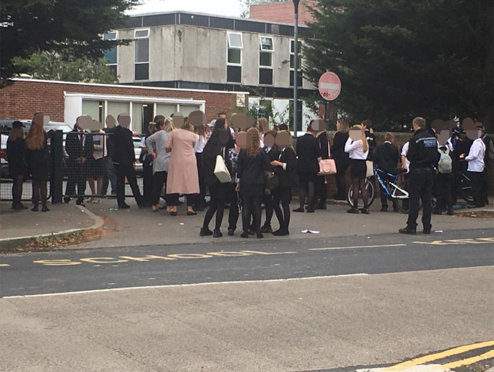 Scrap . . . crowd outside school gates