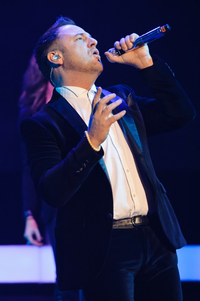  Mikey performs on the Boyzone anniversary tour