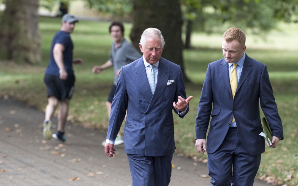  Double take ... men out for a jog in Green Park get a shock as they realise they've just passed Prince Charles