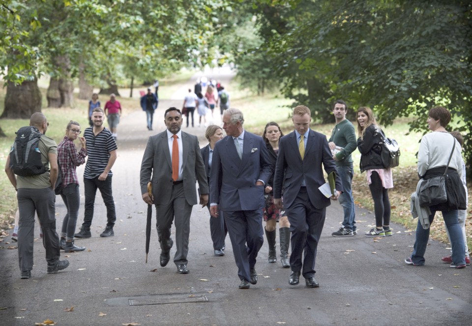  Sticking out like a sore thumb ... tourists and locals in Green Park gape as they realise they're in the presence of royalty