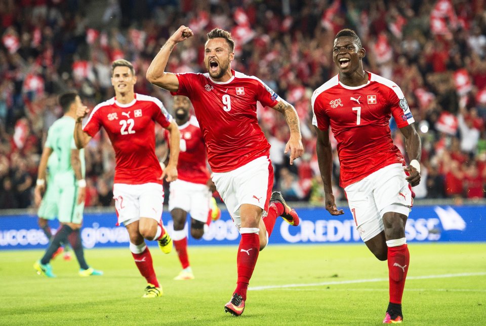  Breel Embolo celebrates with his team-mates after scoring the opening goal