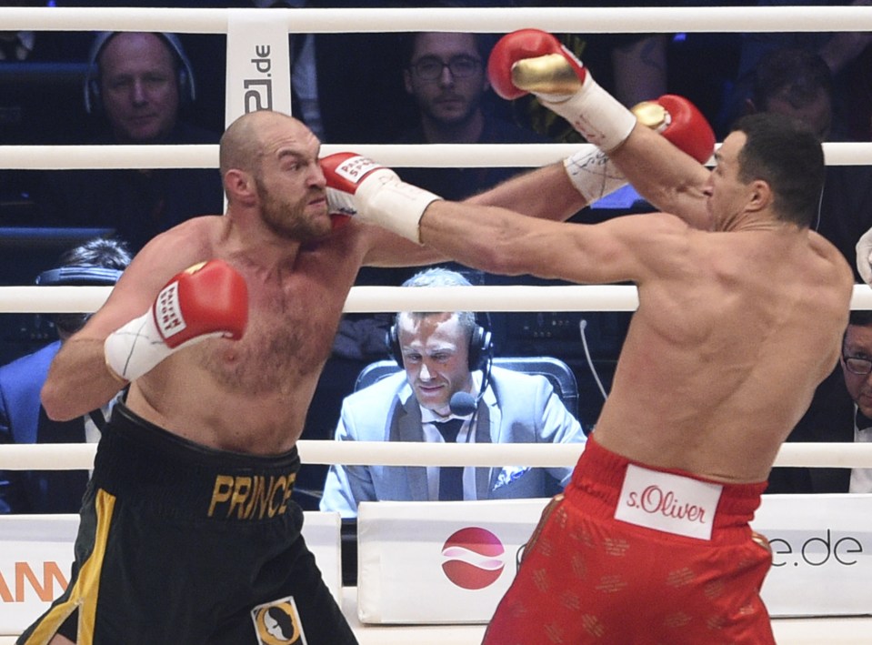 Ukraine's Wladimir Klitschko, right, and Britain's Tyson Fury compete in a world heavyweight title fight for Klitschko's WBA, IBF, WBO and IBO belts