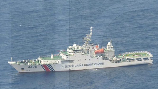  A photograph taken by the Philippines Department of Defence shows a Chinese ship cruising through the disputed territory