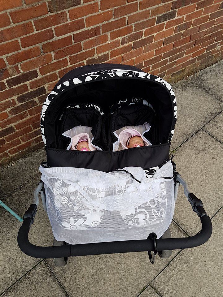 The dolls have their own buggy and Jo loves to take them out and about