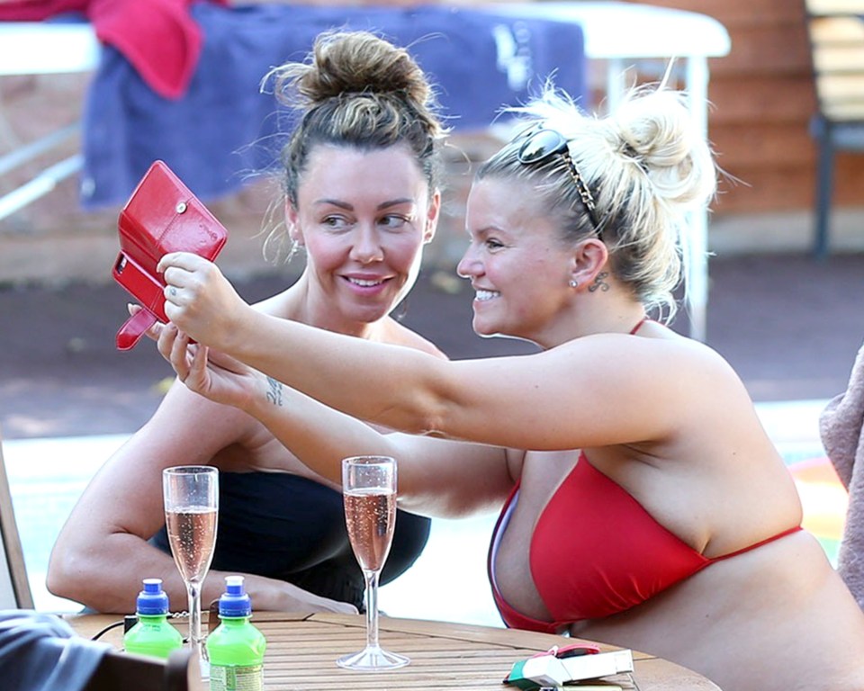  The pair took selfies as the relaxed by the pool