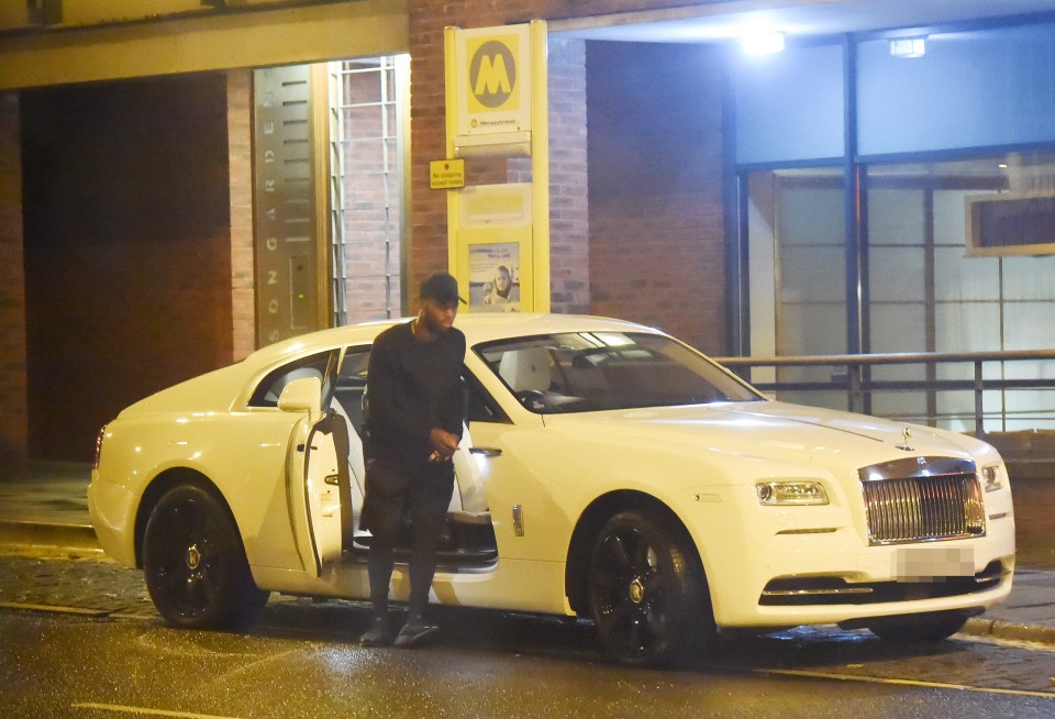 Daniel Sturridge gets out of his car parked up in a bus stop in Liverpool