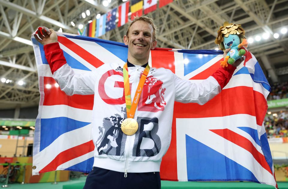 Great Britain's Jody Cundy celebrates on the podium with his Gold medal during the medal ceremony for the Men's C4-5 1000m Time Trial