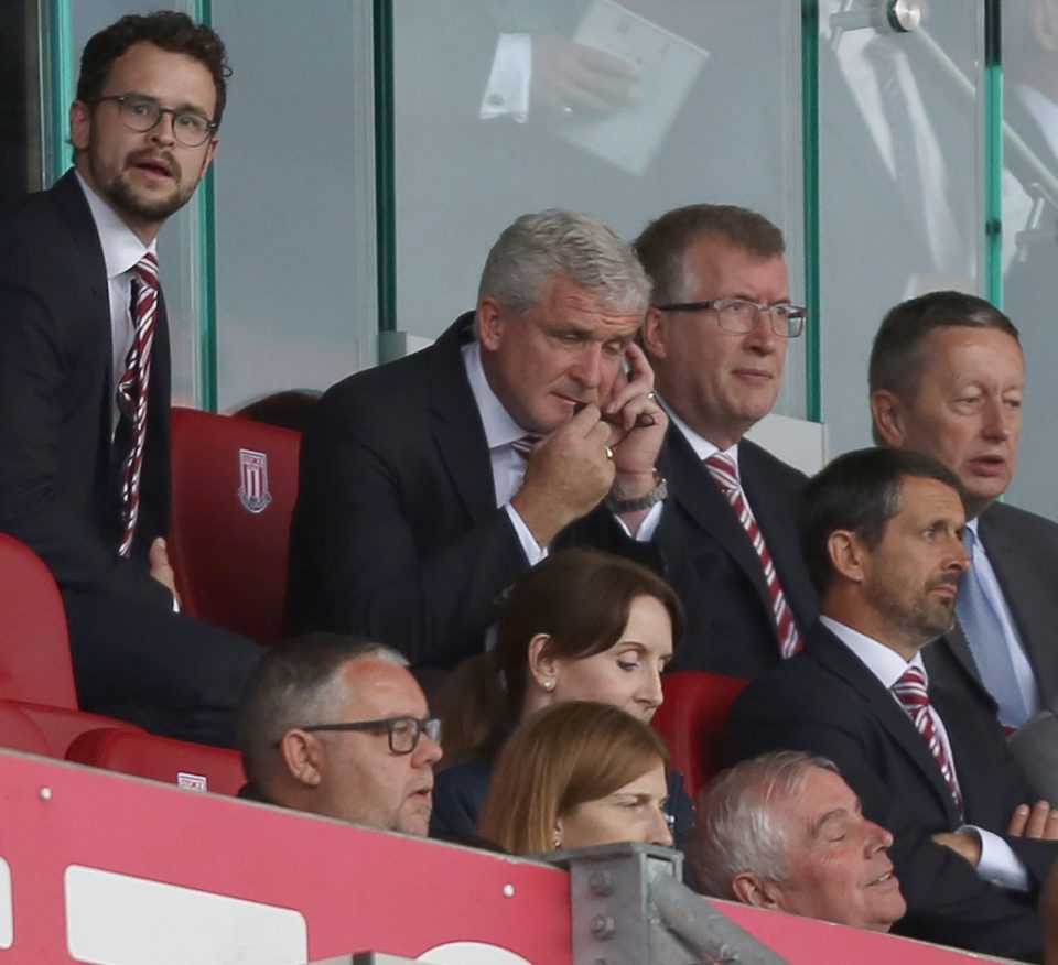  Hughes gives instructions from the stands but could do little to stop Spurs romping to a 4-0 win