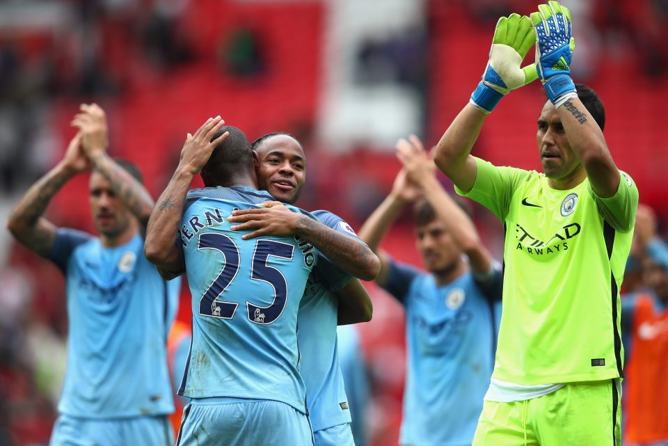 City players celebrate at the final whistle after defeating their fierce rivals United 2-1 at Old Trafford