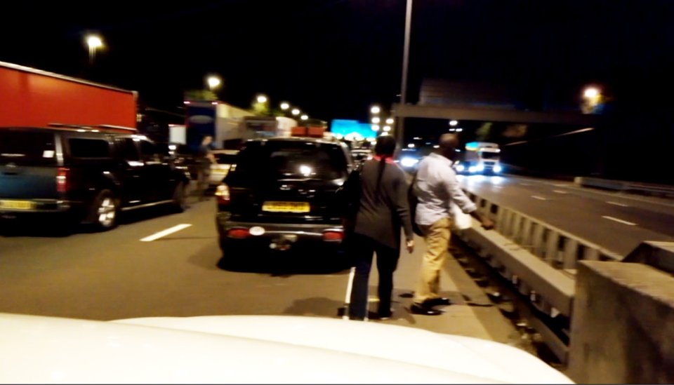 Shocked witnesses couldn't believe their eyes when the couple began to climb over the barricade 