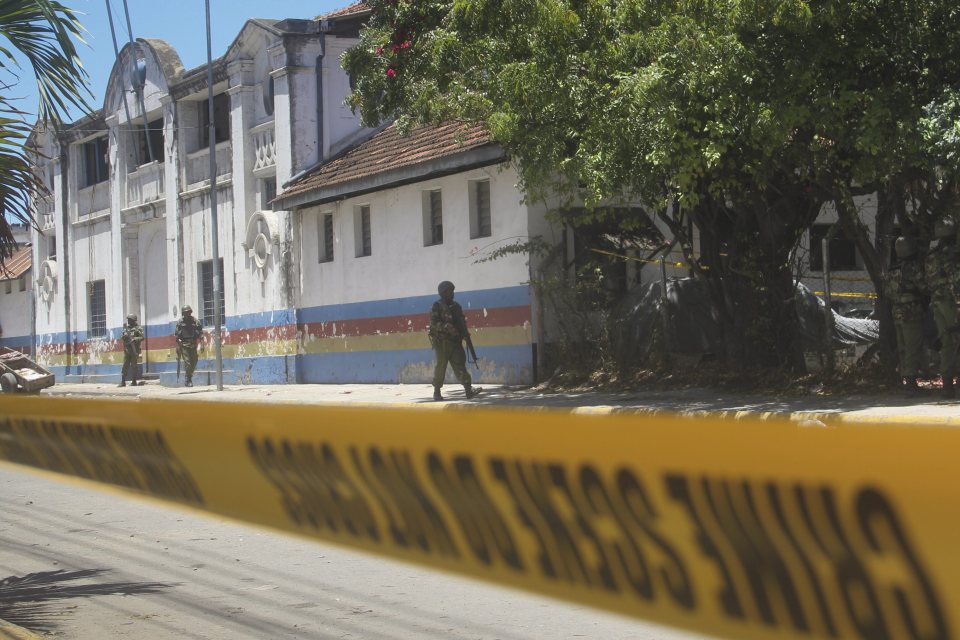 Kenyan soldiers walk in front of the Central Police Station in Mombasa