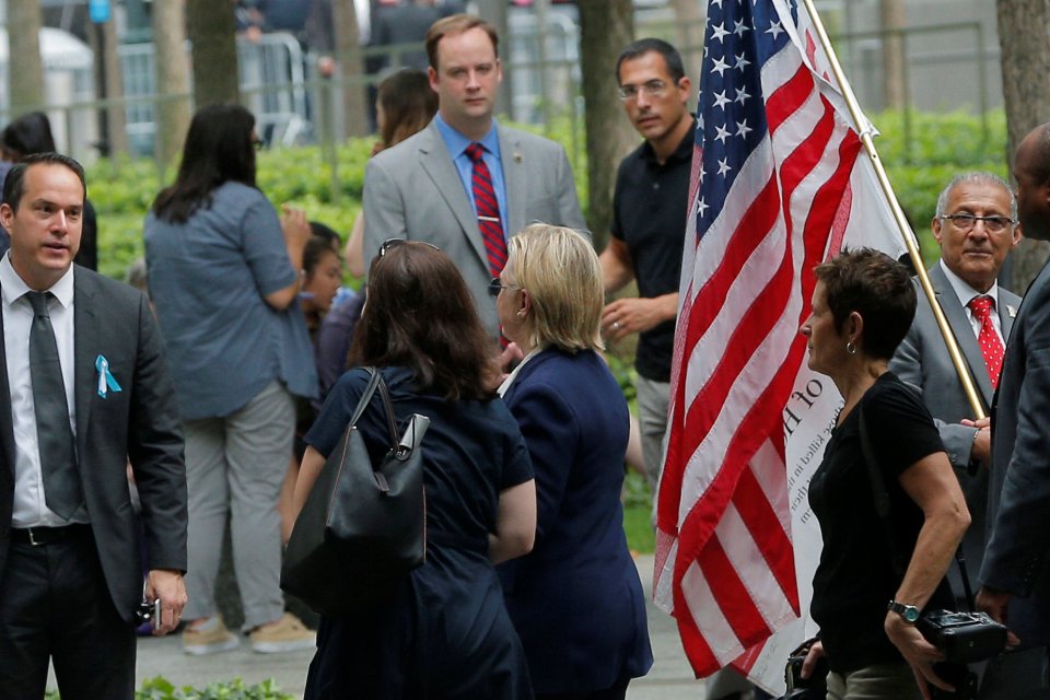 Hillary Clinton was led away from the memorial service