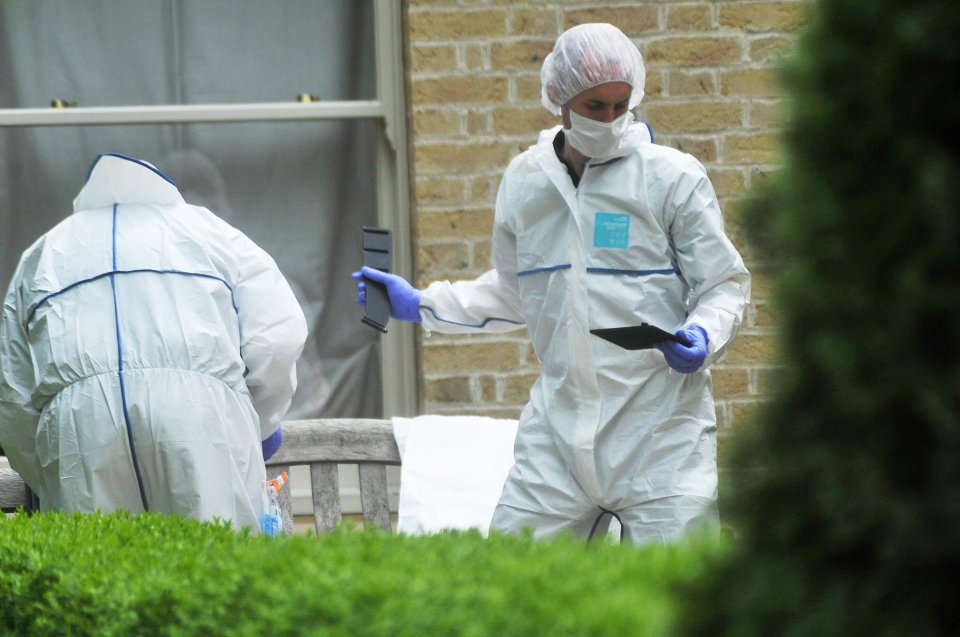 Forensic officers pictured searching the family home after Mrs Nicoll hanged herself