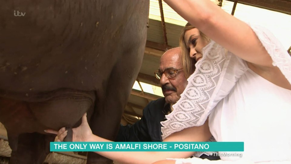 The pair had the opportunity to milk a buffalo