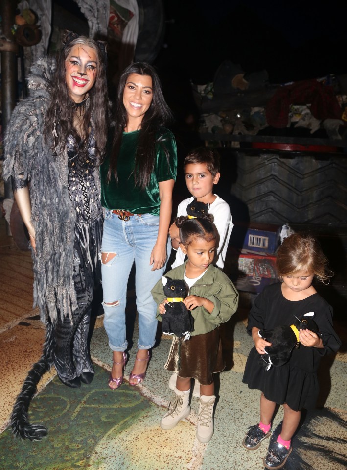  Kourtney looks like she's having more fun than the kids she brought along with her