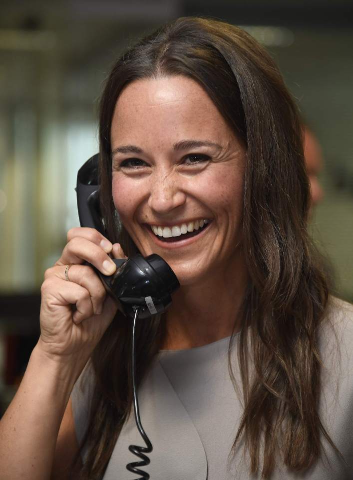 Britain's Middleton speaks on a telephone as dealers work on a trading floor during a charity day at BGC Partners in the Canary Wharf business district in London, Britain