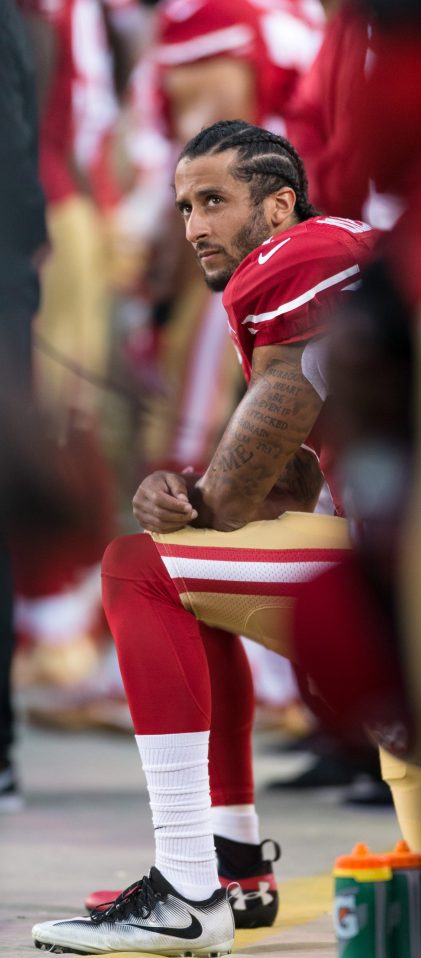  The San Francisco 49ers quarterback says he will not stand until he sees real change