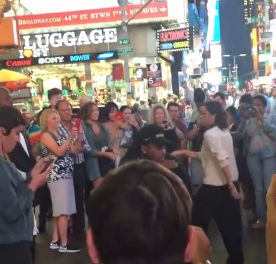  Cringe factor ... Posh dances in the street while fans watch