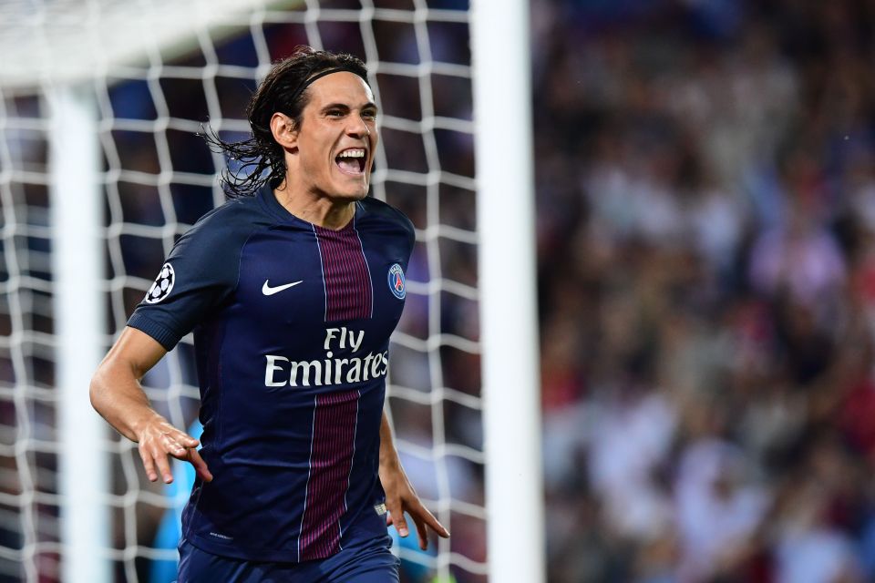 Edinson Cavani wheels away in celebration after his first minute header put PSG ahead against Arsenal