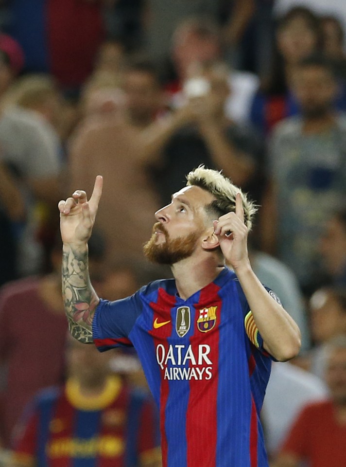 Lionel Messi celebrates scoring his first goal as Barcelona take the lead against Celtic