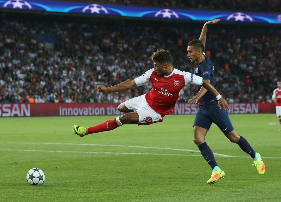 Alex Oxlade-Chamberlain takes a tumble as he struggled to make an impression against PSG