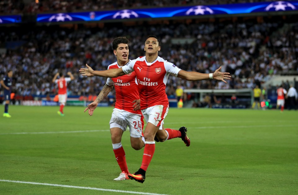 Alexis Sanches and Hector Bellerin celebrate the vital equalising goal against PSG