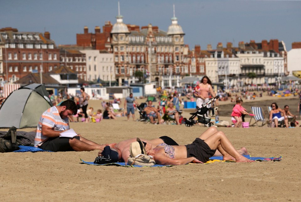  Sun lovers enjoy the glorious weather in Weymouth, Dorset, today