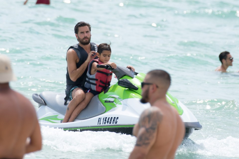  Scott rode on a jet ski with his son Mason