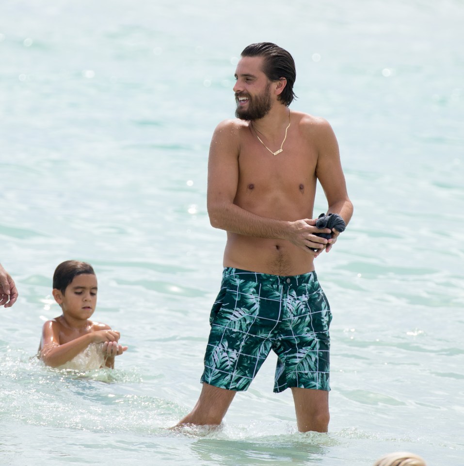  Scott looked happy as he splashed about in the water with Mason