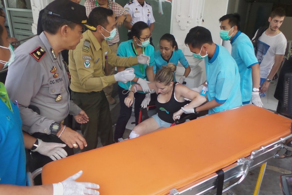  Hospital workers assist an injured tourist