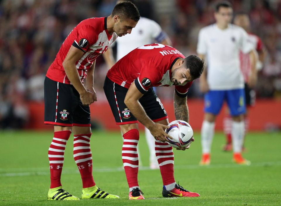  Dusan Tadic tries to reason with Charlie Austin who is having none of it