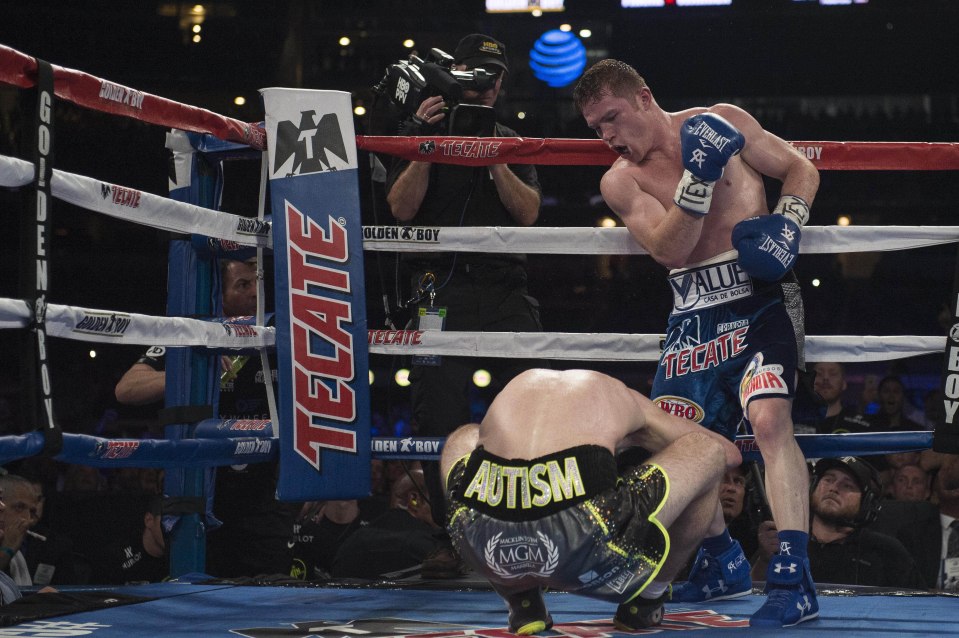 Sep 17, 2016; Arlington, TX, USA; Canelo Alvarez (blue trunks) knocks down Liam Smith (grey trunks) during the WBO middleweight boxing world championship bout at AT&T Stadium. Mandatory Credit: Jerome Miron-USA TODAY Sports