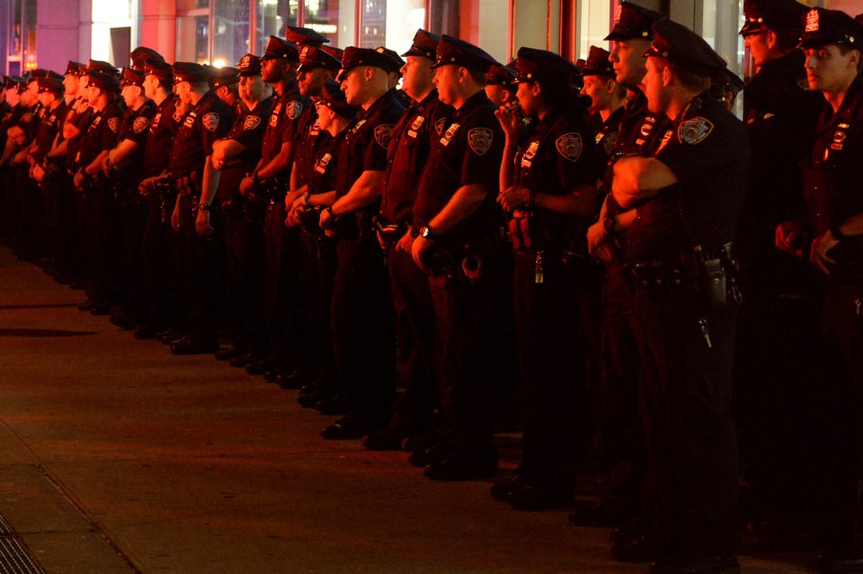  New York police officers keep watch close to the site of the explosion