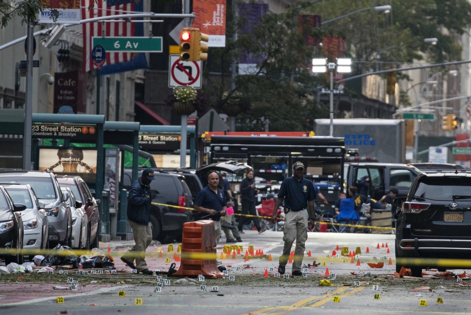  Investigators assess the damage in daylight following the attack