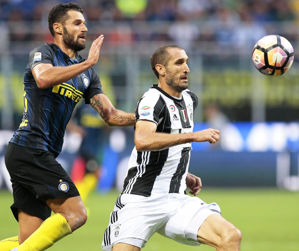  Alves is joined by Juve teammate Giorgio Chiellini