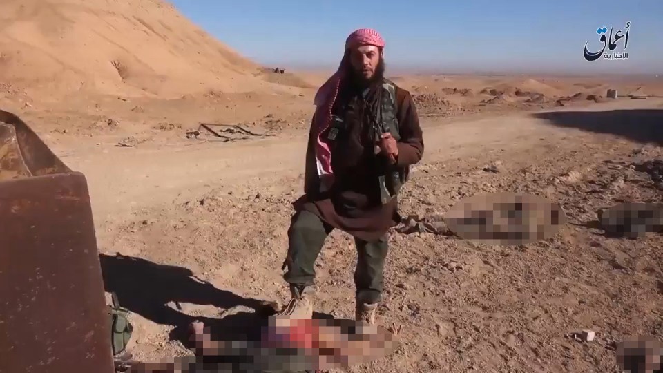 The ISIS killer proudly stands with his boot on the corpse of a Syrian soldier