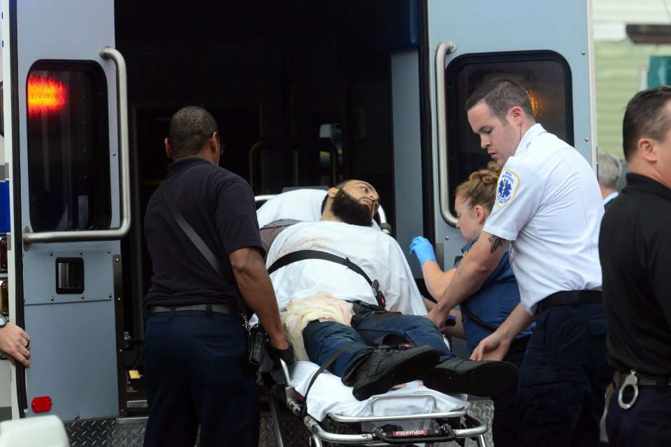  The suspected bomber is loaded into an ambulance