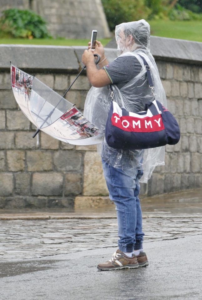  This will become more of a frequent sight - people in the rain in Windsor