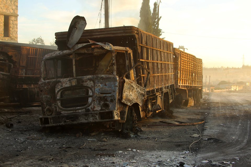  Damaged aid trucks are pictured after an airstrike on the rebel held Urm al-Kubra