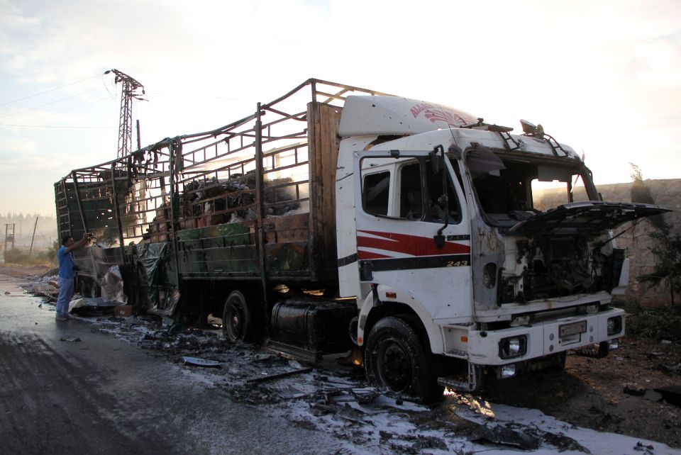  A damaged truck carrying aid is seen on the side of the road in the town of Orum al-Kubra on the outskirts of Aleppo