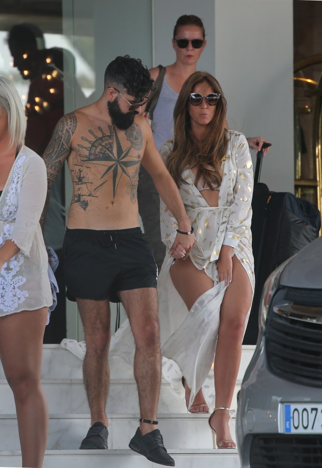  The couple hold hands as they hotel in Ibiza