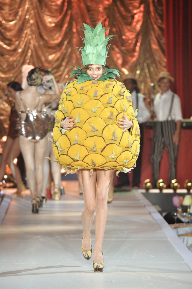 A model in the Charlotte Olympia show, dressed as a pineapple 