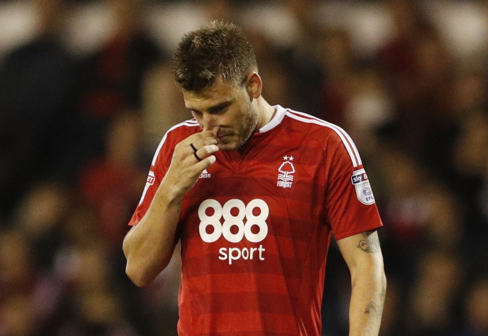  Arsenal old boy Nicklas Bendtner reacts at the City Ground