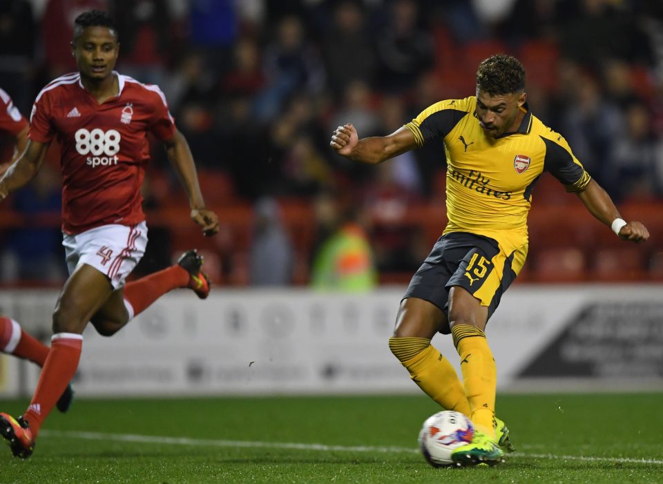 Alex Oxlade-Chamberlain of Arsenal scores his team's fourth