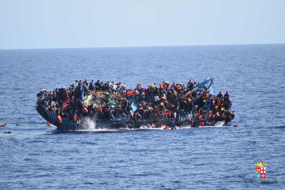  Migrants in an overcrowded boat about to capsize on the coast of Sicily